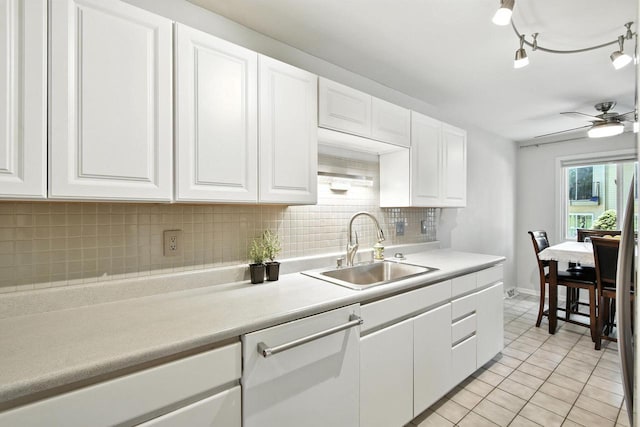 W169N11470 Biscayne Dr Unit 7, Germantown, WI 53022 - kitchen with dishwasher, light tile patterned flooring, a ceiling fan, white cabinets, and decorative backsplash