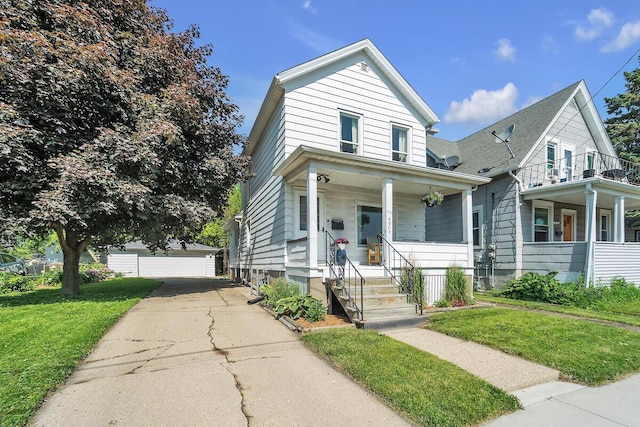 4904 25th Ave, Kenosha, WI 53140 - view of front of home featuring covered porch, an outbuilding, a front yard, and a detached garage