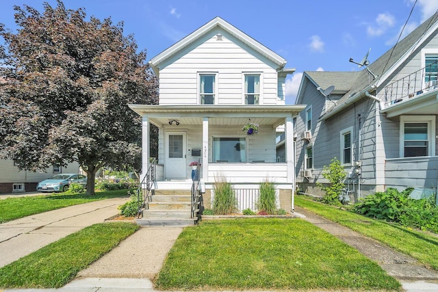 4904 25th Ave, Kenosha, WI 53140 - view of front of house featuring covered porch and a front yard