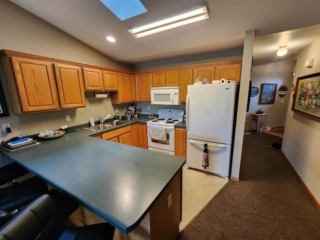 584 N Wisconsin St, Berlin, WI 54923 - kitchen featuring white appliances, dark countertops, a peninsula, backsplash, and lofted ceiling