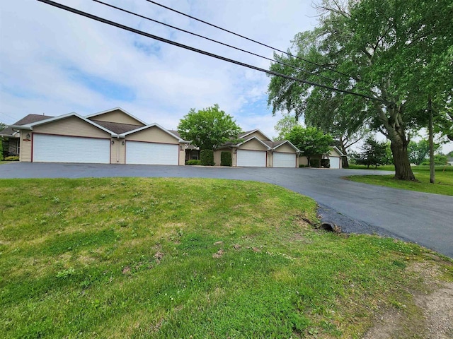 584 N Wisconsin St, Berlin, WI 54923 - ranch-style house with a front yard and a garage