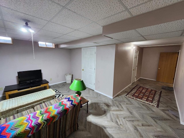 584 N Wisconsin St, Berlin, WI 54923 - below grade area featuring baseboards and a paneled ceiling
