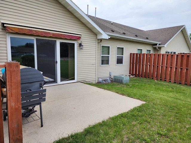 584 N Wisconsin St, Berlin, WI 54923 - back of property featuring a patio area and a shingled roof