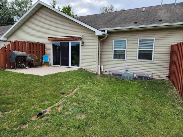 584 N Wisconsin St, Berlin, WI 54923 - back of property featuring a patio and a shingled roof