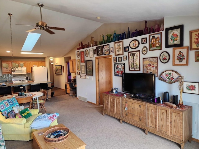584 N Wisconsin St, Berlin, WI 54923 - living area featuring ceiling fan, a skylight, vaulted ceiling, and light colored carpet