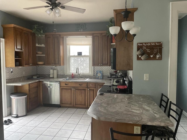840 Lincoln Blvd, Manitowoc, WI 54220 - kitchen featuring dishwasher, a ceiling fan, light tile patterned floors, and decorative backsplash