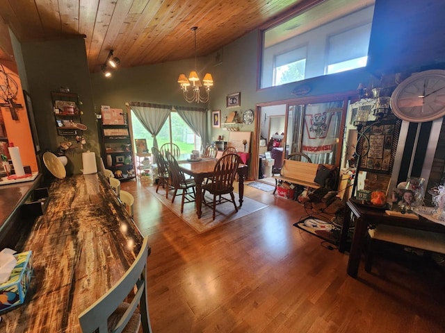 221 S Schmidt Ave, Marshfield, WI 54449 - dining space with a chandelier, a towering ceiling, wood finished floors, wooden ceiling, and healthy amount of natural light