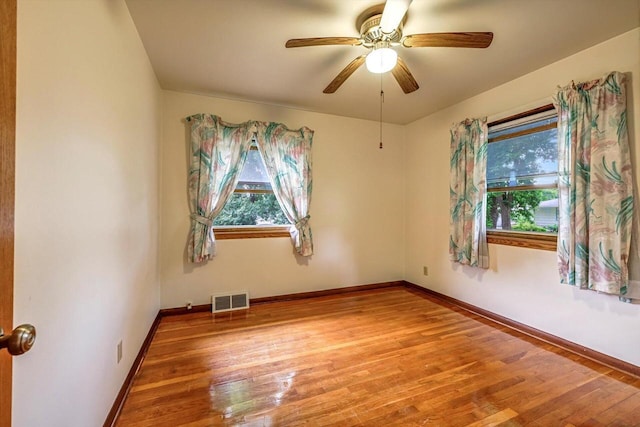 1981 Jan Ave, Waukesha, WI 53188 - empty room with healthy amount of natural light, wood finished floors, and ceiling fan