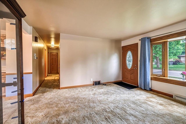1981 Jan Ave, Waukesha, WI 53188 - carpeted entrance foyer featuring healthy amount of natural light and a baseboard heating unit