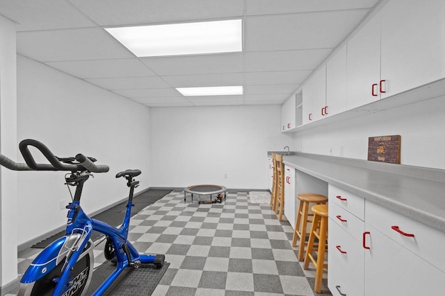 1001 W Taylor St, Appleton, WI 54914 - exercise area featuring a drop ceiling and dark flooring