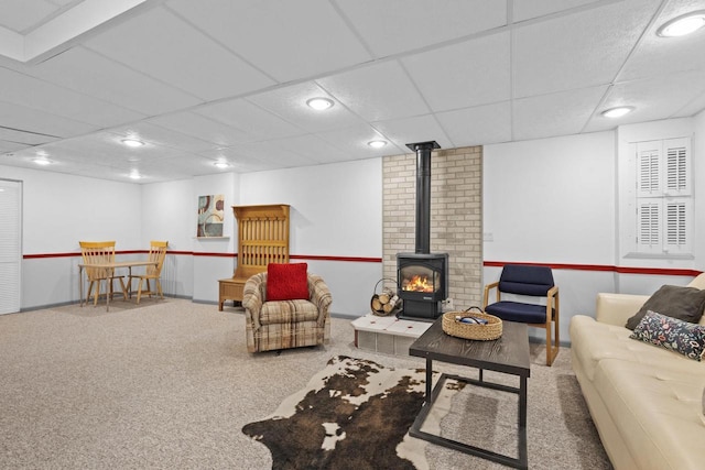 1001 W Taylor St, Appleton, WI 54914 - carpeted living room with a wood stove, a paneled ceiling, and recessed lighting