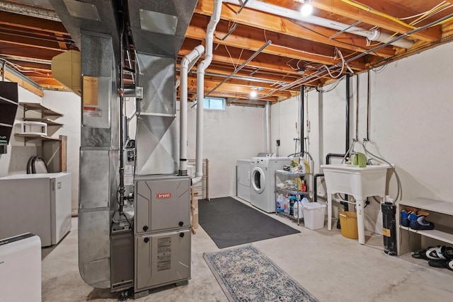 1001 W Taylor St, Appleton, WI 54914 - below grade area featuring washer and clothes dryer and heating unit