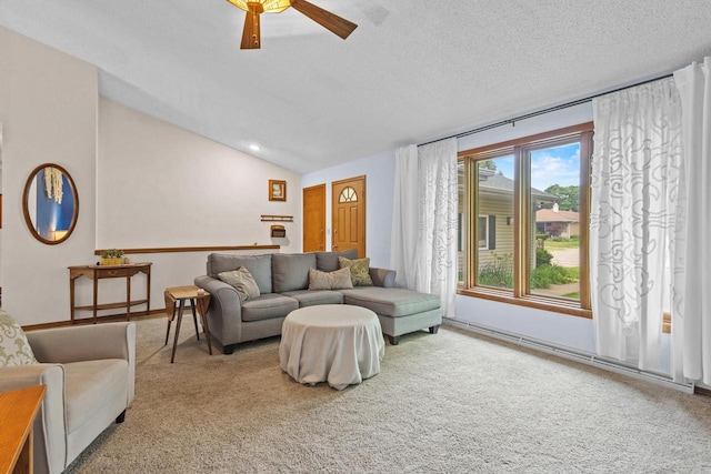 1001 W Taylor St, Appleton, WI 54914 - living room featuring vaulted ceiling, carpet flooring, ceiling fan, and a textured ceiling