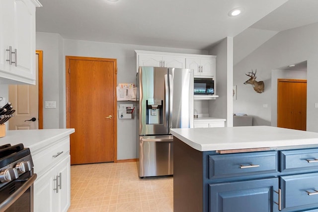 2847 Virgo Rd, Green Bay, WI 54311 - kitchen with stainless steel appliances, blue cabinetry, white cabinets, light countertops, and recessed lighting