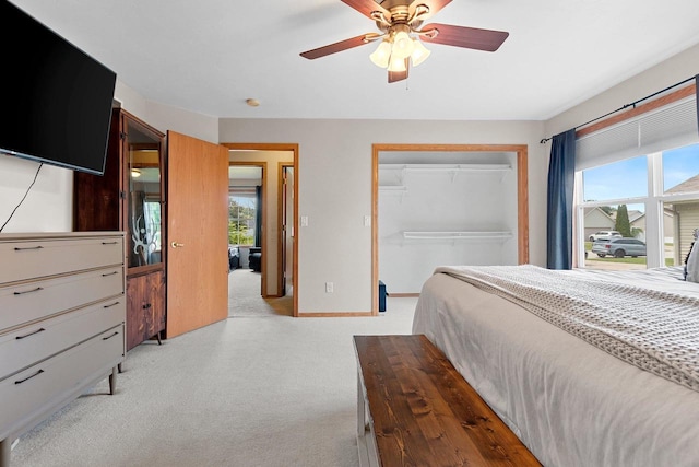 2847 Virgo Rd, Green Bay, WI 54311 - bedroom with multiple windows, light carpet, a closet, and ceiling fan