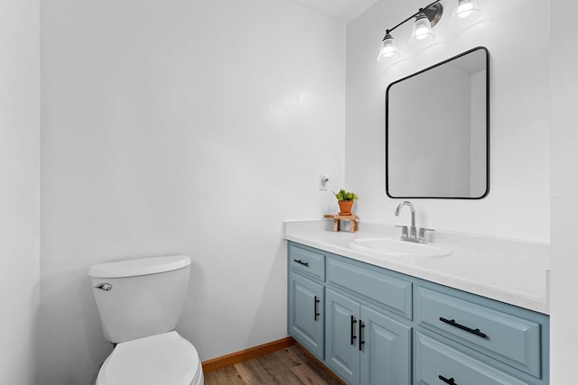2847 Virgo Rd, Green Bay, WI 54311 - half bathroom featuring vanity and wood finished floors