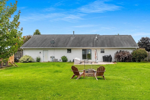 2847 Virgo Rd, Green Bay, WI 54311 - back of property featuring an outdoor fire pit, a lawn, and a patio area
