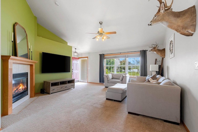 2847 Virgo Rd, Green Bay, WI 54311 - carpeted living room with vaulted ceiling, ceiling fan, and a tiled fireplace
