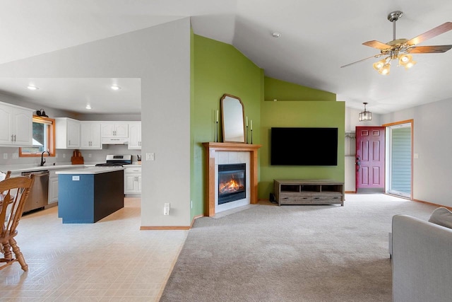 2847 Virgo Rd, Green Bay, WI 54311 - living room featuring high vaulted ceiling, a fireplace, light carpet, ceiling fan, and recessed lighting