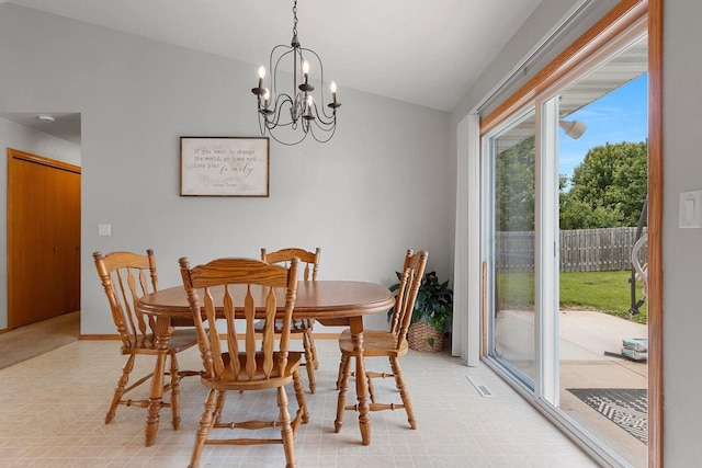 2847 Virgo Rd, Green Bay, WI 54311 - dining area with lofted ceiling, a chandelier, and light flooring