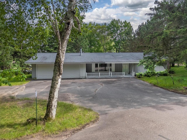 9315 N Shore Dr, Harshaw, WI 54529 - ranch-style home with driveway, a porch, and an attached garage