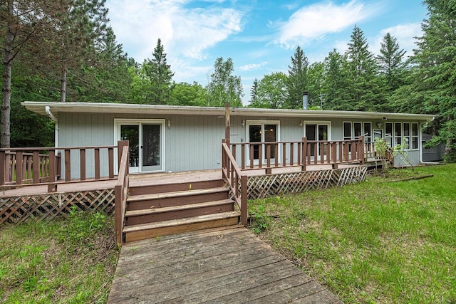 9315 N Shore Dr, Harshaw, WI 54529 - view of front facade featuring a wooden deck and a front yard