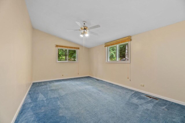 9315 N Shore Dr, Harshaw, WI 54529 - spare room featuring a ceiling fan, plenty of natural light, carpet floors, and vaulted ceiling