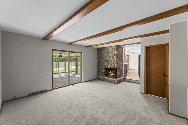 6101 W Edgerton Ave, Greendale, WI 53129 - unfurnished living room with beam ceiling, a stone fireplace, and carpet flooring