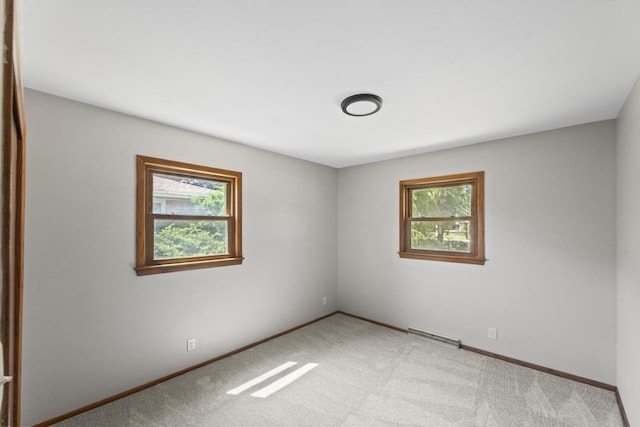 6101 W Edgerton Ave, Greendale, WI 53129 - unfurnished room featuring baseboards and light carpet