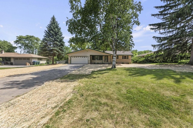 6101 W Edgerton Ave, Greendale, WI 53129 - ranch-style house with a front lawn, an attached garage, and driveway