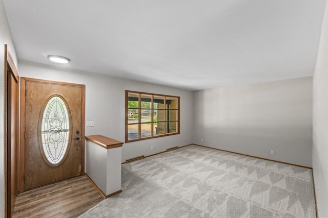 6101 W Edgerton Ave, Greendale, WI 53129 - foyer entrance featuring baseboards and light carpet