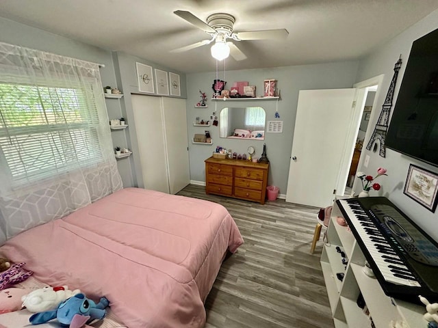 5510 W Luebbe Ln, Milwaukee, WI 53223 - bedroom featuring multiple windows, wood finished floors, and ceiling fan
