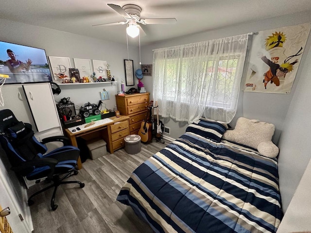 5510 W Luebbe Ln, Milwaukee, WI 53223 - bedroom with wood finished floors, a ceiling fan, and a desk