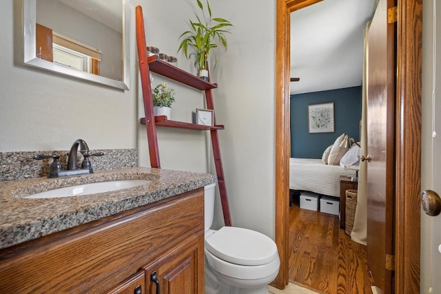 7939 32nd Ave, Kenosha, WI 53144 - ensuite bathroom featuring vanity and wood finished floors