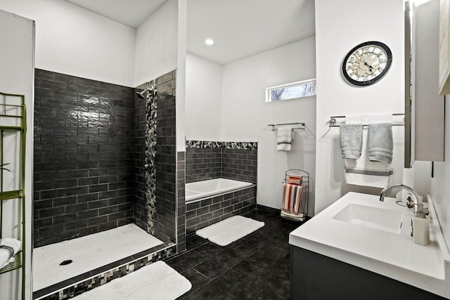 1100 W Fairy Chasm Rd, River Hills, WI 53217 - bathroom with a bath, tiled shower, vanity, tile patterned flooring, and recessed lighting