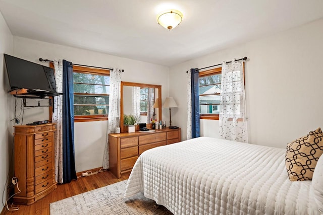1100 W Fairy Chasm Rd, River Hills, WI 53217 - bedroom featuring wood finished floors and baseboards