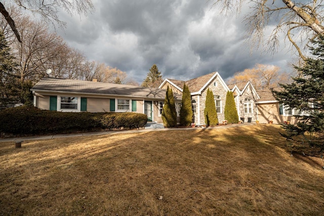1100 W Fairy Chasm Rd, River Hills, WI 53217 - view of front of home featuring a front yard and stone siding