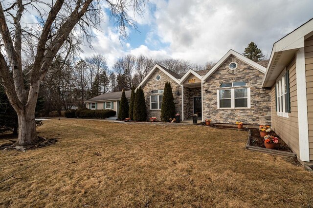 1100 W Fairy Chasm Rd, River Hills, WI 53217 - ranch-style home with a front yard and stone siding