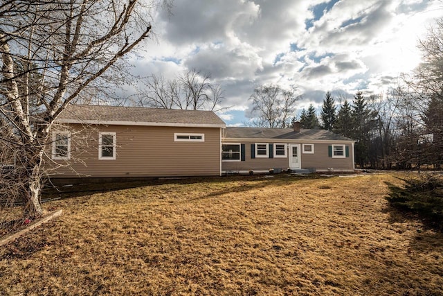 1100 W Fairy Chasm Rd, River Hills, WI 53217 - back of property featuring a chimney, a yard, and entry steps