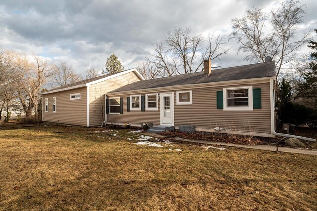 1100 W Fairy Chasm Rd, River Hills, WI 53217 - view of front of house with a front lawn and a chimney