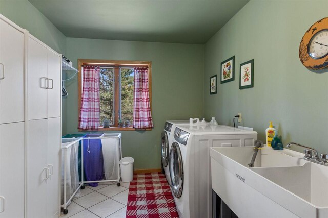 W11686 Buttercup Ave, Hancock, WI 54943 - laundry room featuring cabinet space, independent washer and dryer, and light tile patterned floors