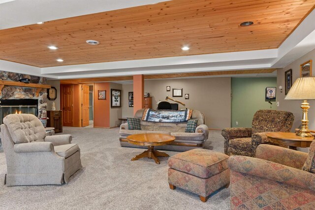 W11686 Buttercup Ave, Hancock, WI 54943 - carpeted living room with wood ceiling, a raised ceiling, recessed lighting, and a stone fireplace