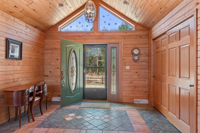 W11686 Buttercup Ave, Hancock, WI 54943 - foyer featuring wooden ceiling, healthy amount of natural light, wood walls, high vaulted ceiling, and a chandelier