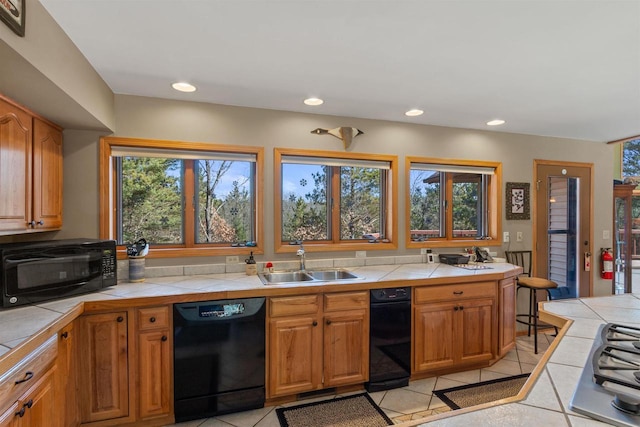 W11686 Buttercup Ave, Hancock, WI 54943 - kitchen featuring black appliances, tile countertops, plenty of natural light, and recessed lighting