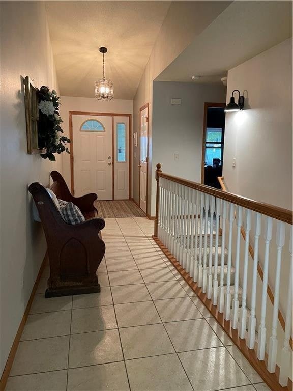 1762 Wilson Ave, Menomonie, WI 54751 - foyer entrance with light tile patterned flooring and a chandelier