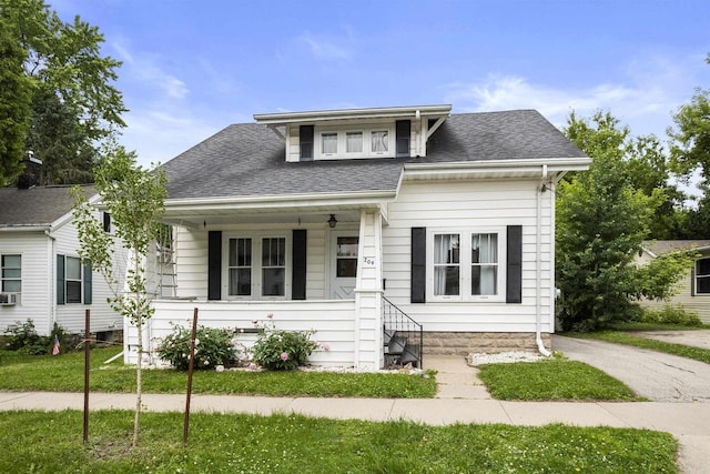 209 N Rankin St, Appleton, WI 54911 - bungalow with a shingled roof, a porch, and a front lawn