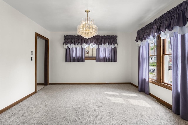 209 N Rankin St, Appleton, WI 54911 - spare room featuring a chandelier, plenty of natural light, and carpet floors
