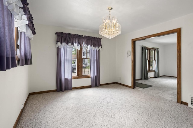 209 N Rankin St, Appleton, WI 54911 - carpeted empty room featuring healthy amount of natural light and a chandelier