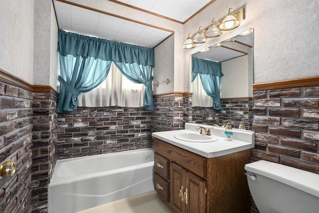 209 N Rankin St, Appleton, WI 54911 - bathroom with vanity, a bath, a wainscoted wall, and a textured wall