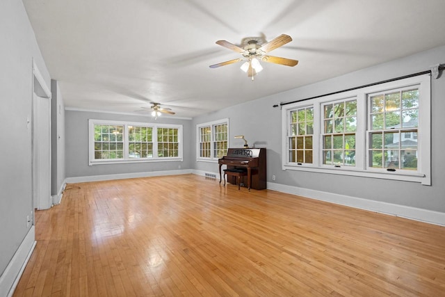 928 Emilie St, Green Bay, WI 54301 - living area featuring a ceiling fan and light wood-style floors